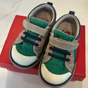 See Kai Run sneakers! Well loved but still looking good.